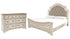 Realyn Queen Upholstered Panel Bed with Dresser